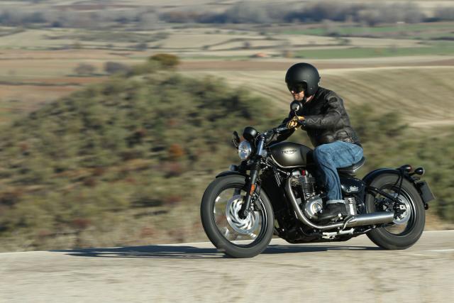 Man riding Triumph Bonneville Bobber Motorcycle
